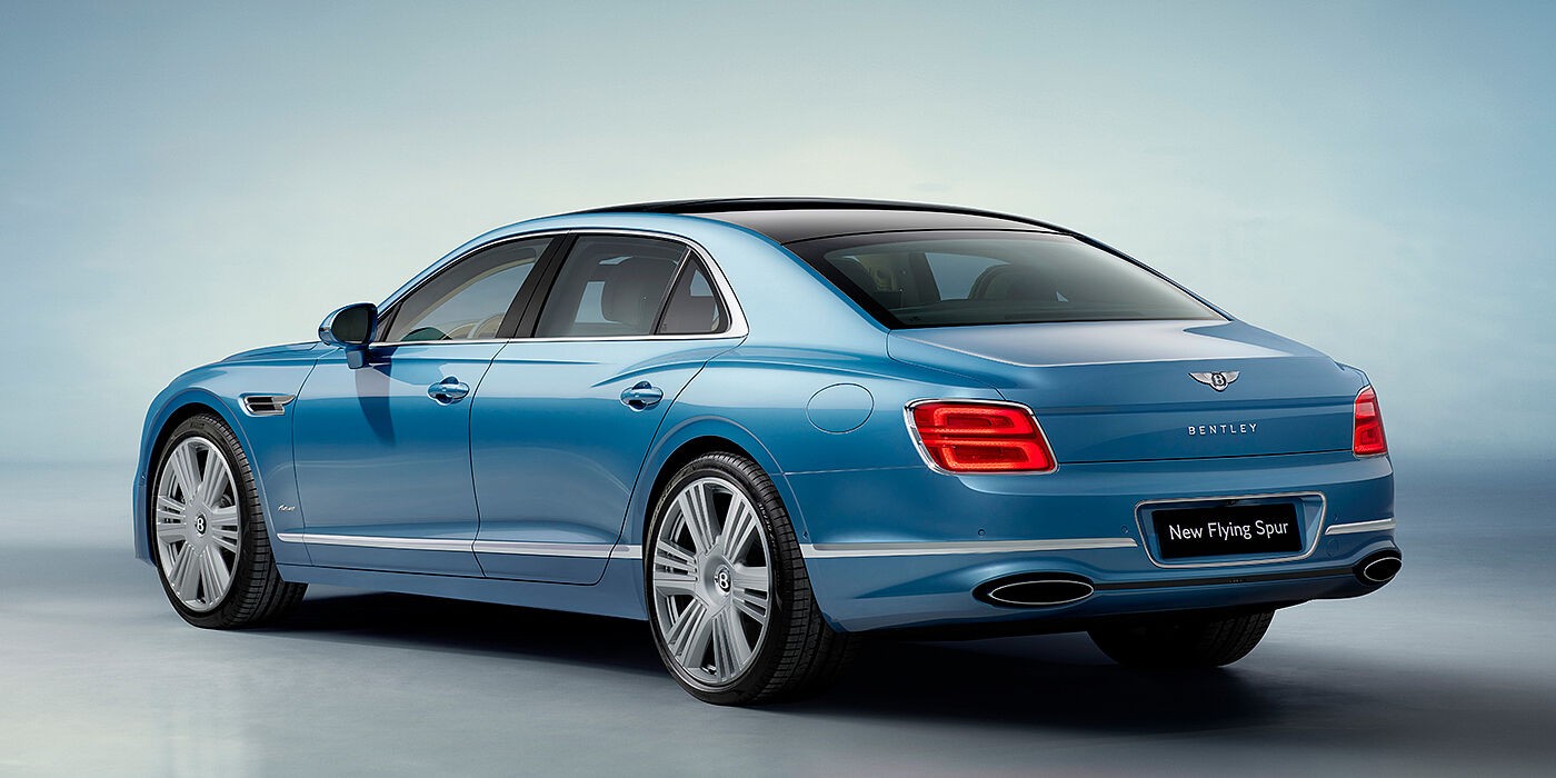 Bentley Roma New Bentley Flying Spur Azure sedan rear view in Light windsor blue by Mulliner paint with 22 inch Azure wheels and chrome exterior details