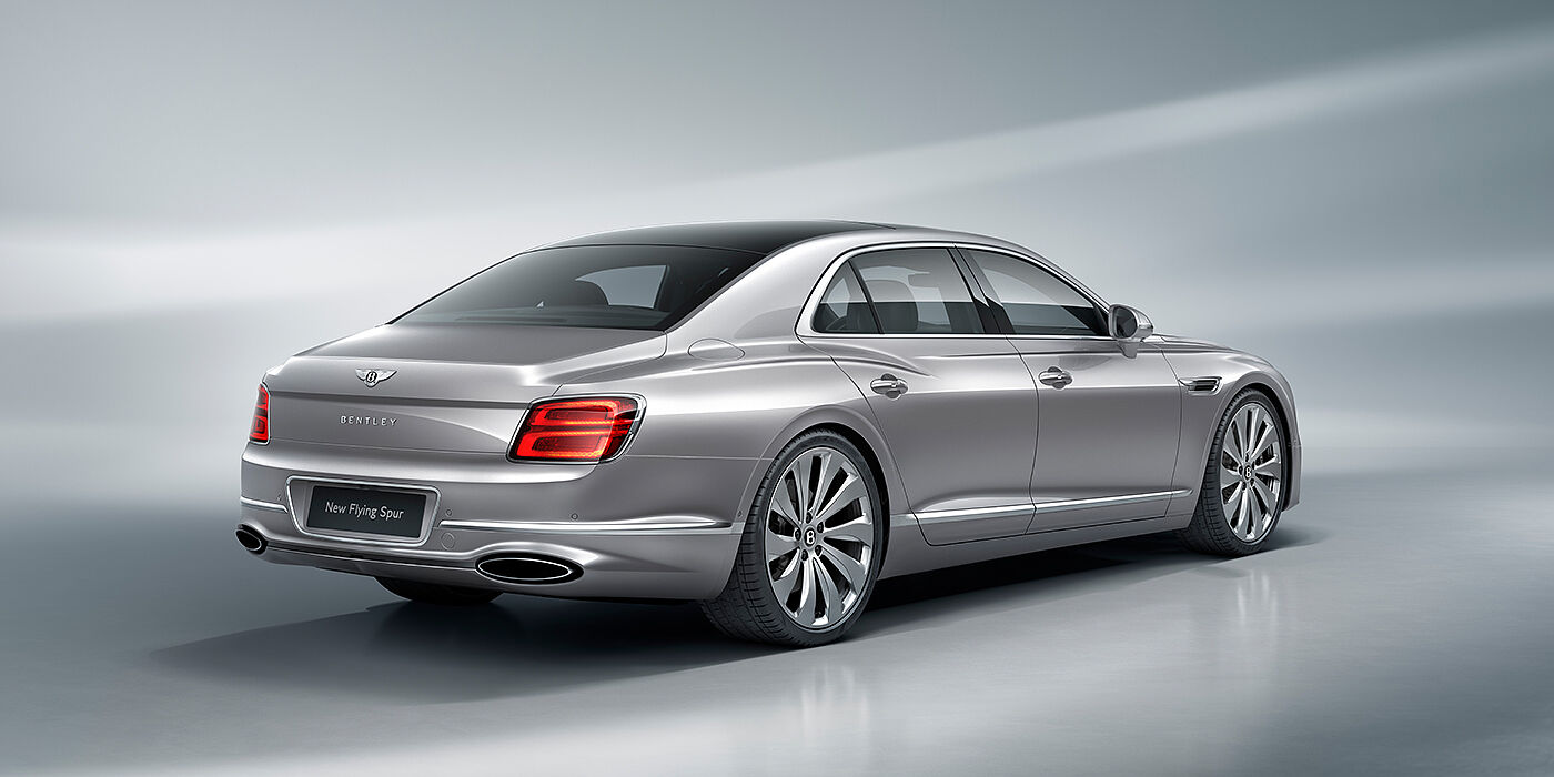 Bentley Roma New Bentley Flying Spur sedan rear view in Silverlake paint with ten spoke wheels and chrome matrix grille