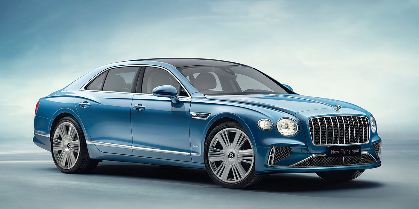 Bentley Roma New Bentley Flying Spur Azure sedan front view in Light windsor blue by Mulliner paint with 22 inch Azure wheels and chrome exterior details