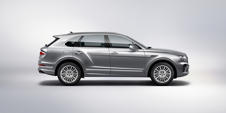 Bentley Roma Bentley Bentayga SUV side profile in Moonbeam silver paint against white background featuring 21 inch 5 spoke wheels